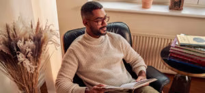 person, reading, clothing, knitwear, sweater, face, head