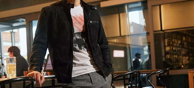 clothing, coat, jacket, blazer, cup, adult, male, man, person, chair