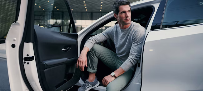 wristwatch, shoe, belt, person, sitting, adult, male, man, car, cushion