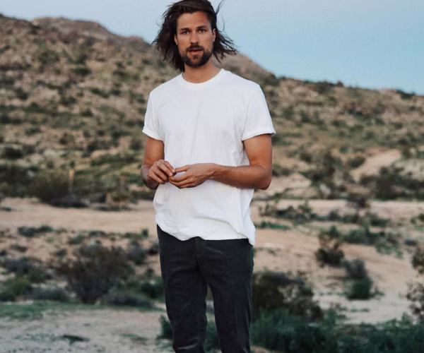 clothing, t-shirt, sleeve, adult, male, man, person, pants, beachwear