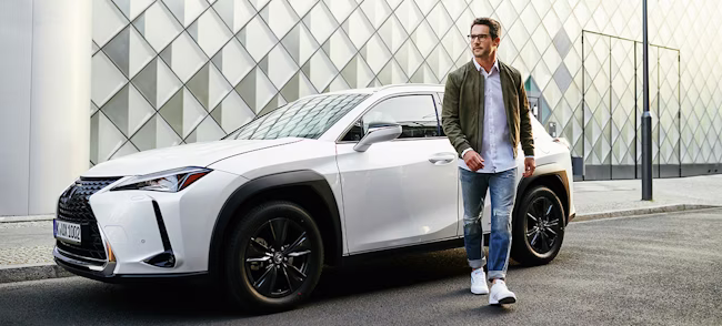 adult, male, man, person, car, coupe, shoe, wheel, pants, coat