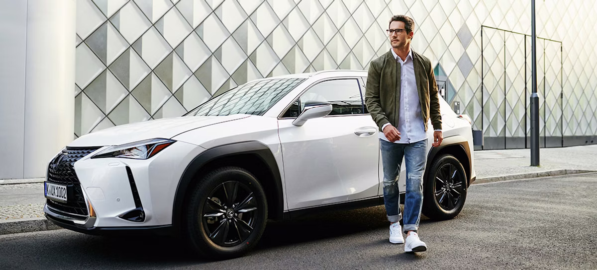 adult, male, man, person, car, coupe, shoe, wheel, pants, coat