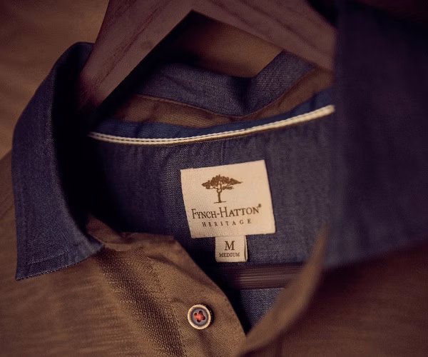 clothing, pants, coat, jacket, vest, shirt, person, jeans, accessories
