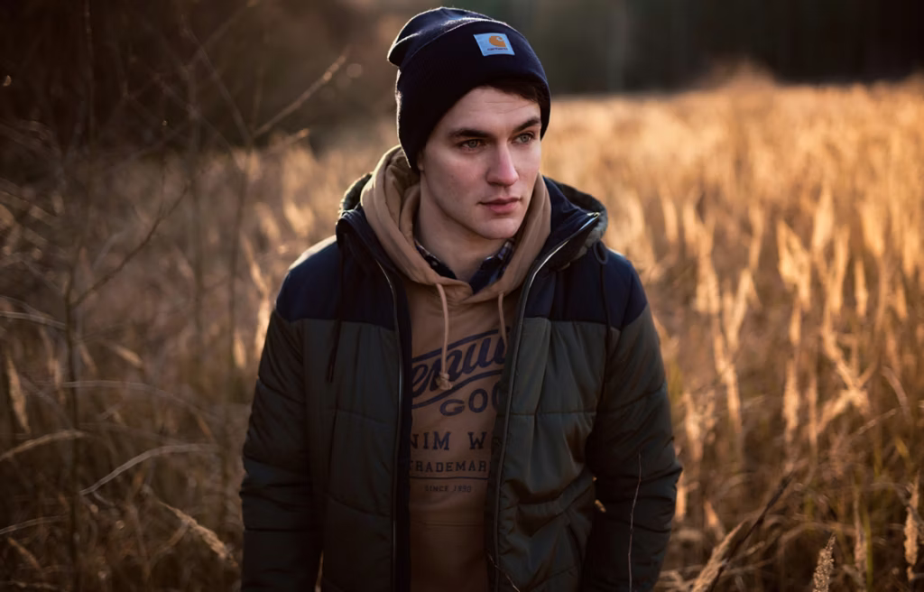 photography, coat, jacket, person, portrait, cap, hat, baseball cap, hoodie, sweatshirt