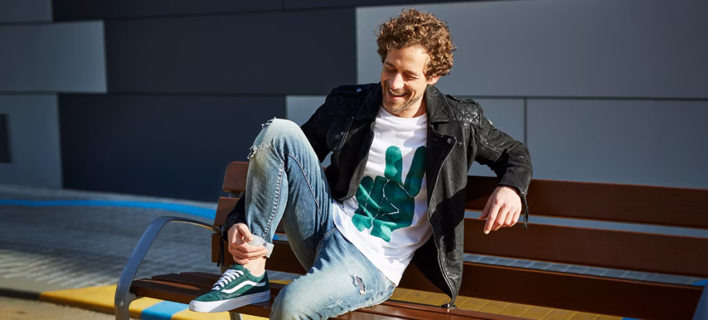 coat, jacket, boy, male, person, teen, sitting, bench, shoe, pants