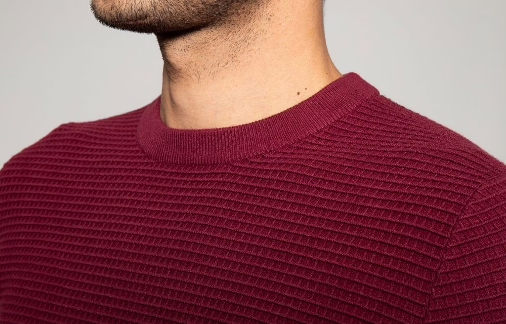 clothing, knitwear, sweater, body part, face, head, neck, person