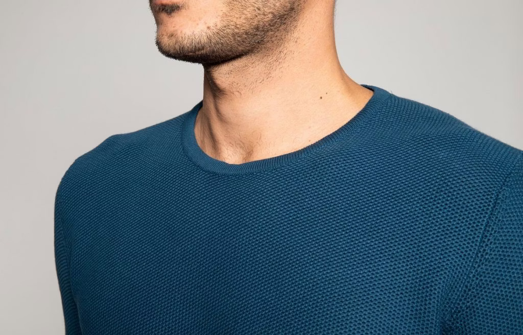 clothing, t-shirt, body part, face, head, neck, person, knitwear, sweater