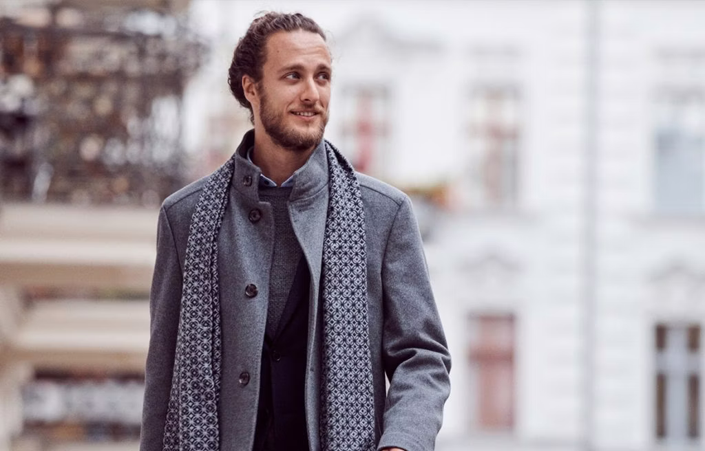 clothing, coat, adult, male, man, person, jacket, face, head, blazer