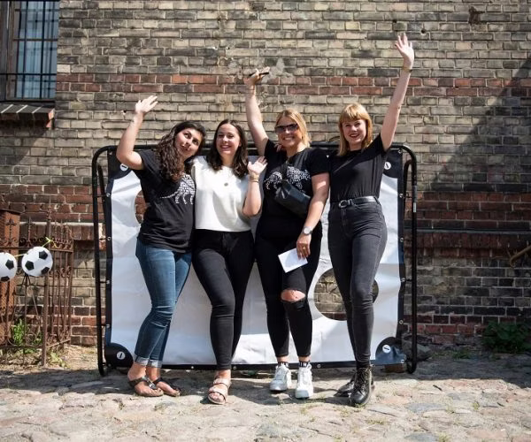 pants, groupshot, person, shoe, soccer ball, adult, female, woman, handbag, glasses