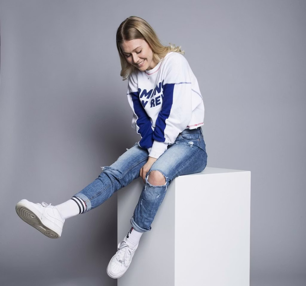 person, sitting, clothing, pants, shoe, female, girl, teen, jeans, sneaker