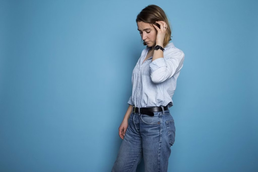 head, person, face, accessories, belt, female, girl, teen, wristwatch, sad