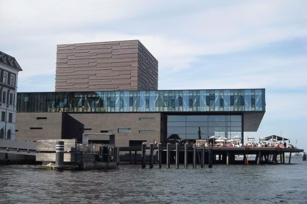 water, waterfront, building, office building, city, pier, convention center, urban, port, outdoors