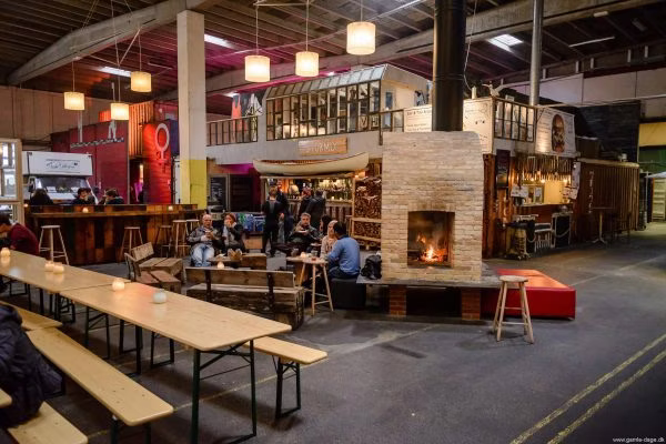 indoors, restaurant, cafeteria, factory, cafe, lamp, person, bench, wood, handbag