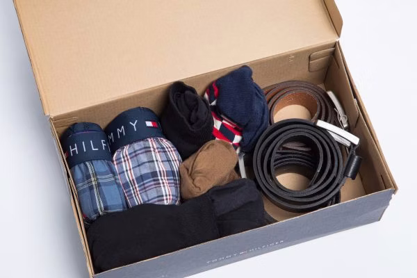 box, formal wear, tie, baseball cap, glove, cardboard, carton, handbag, baby, person