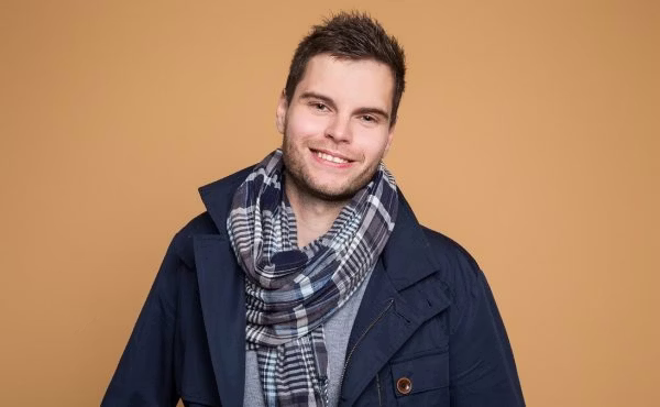 coat, face, head, person, smile, adult, male, man, dimples, scarf