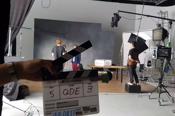 indoors, room, studio, person, clapperboard