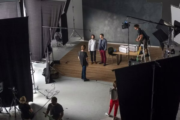 person, adult, male, man, indoors, studio, chair, shoe, box, handbag