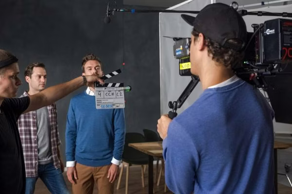 indoors, room, studio, person, clapperboard, conversation