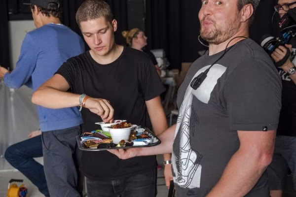 t-shirt, adult, male, man, person, glasses, meal, wristwatch, plate, bowl
