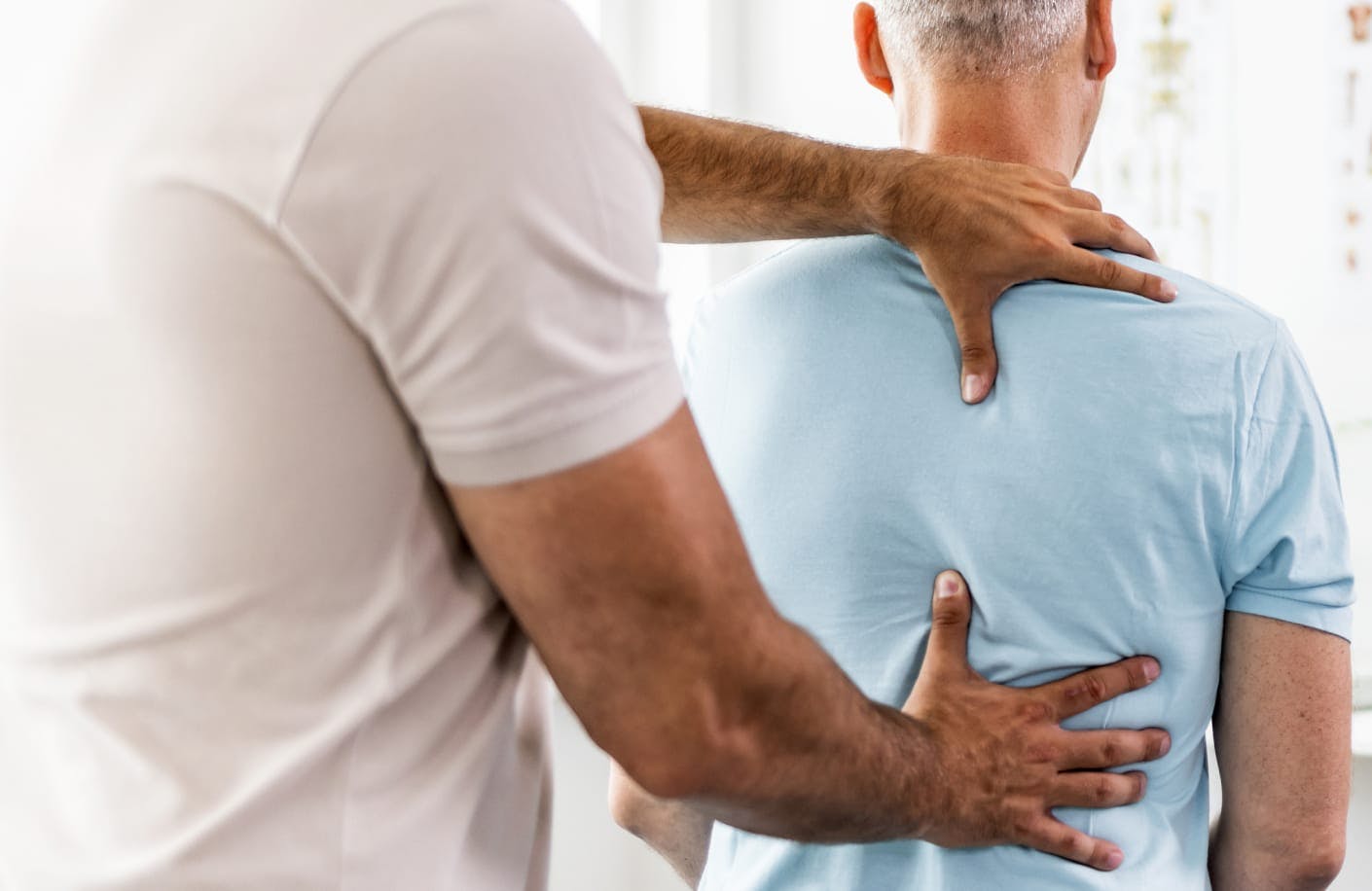 man having their back adjusted