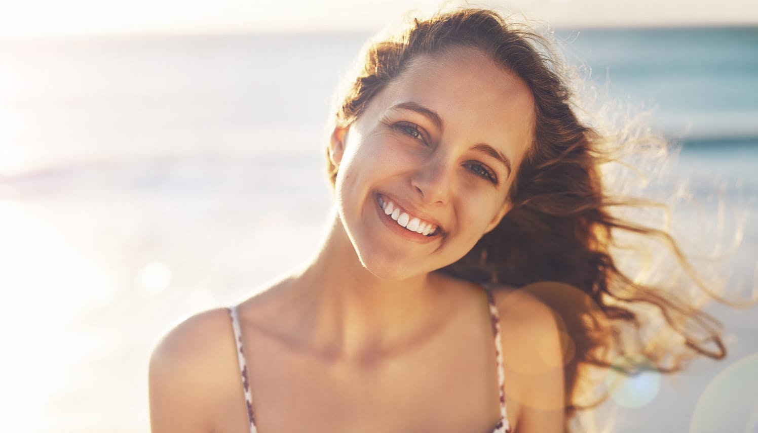 woman smiling on the beach