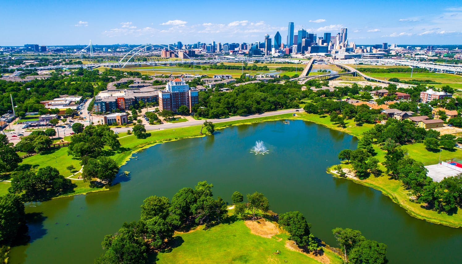 arial view of a lake and a city in the distance