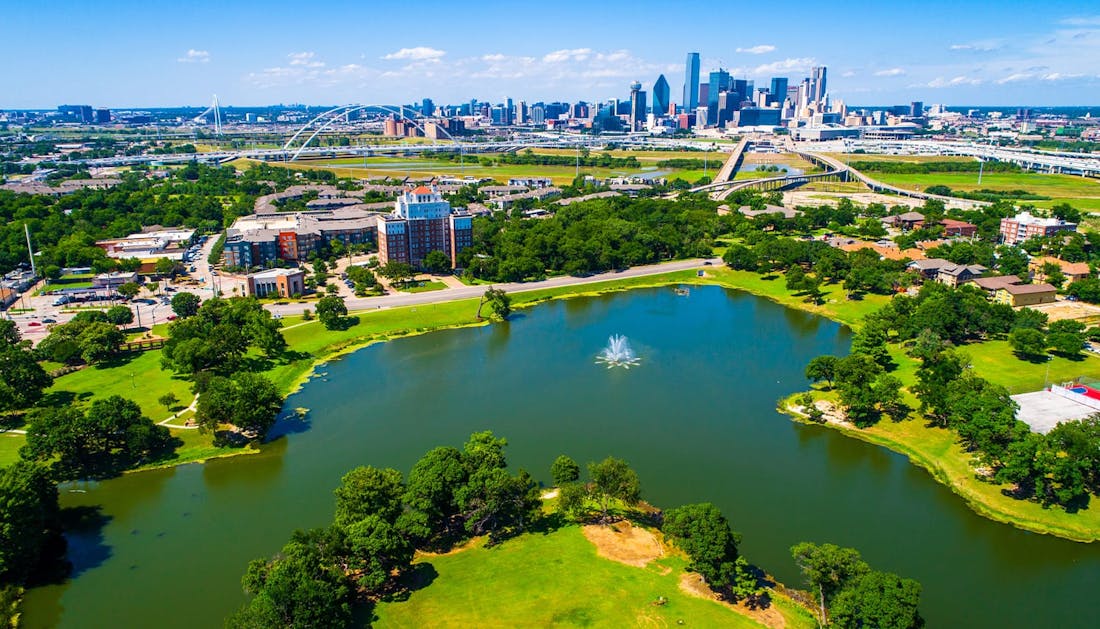 arial view of a lake and a city in the distance