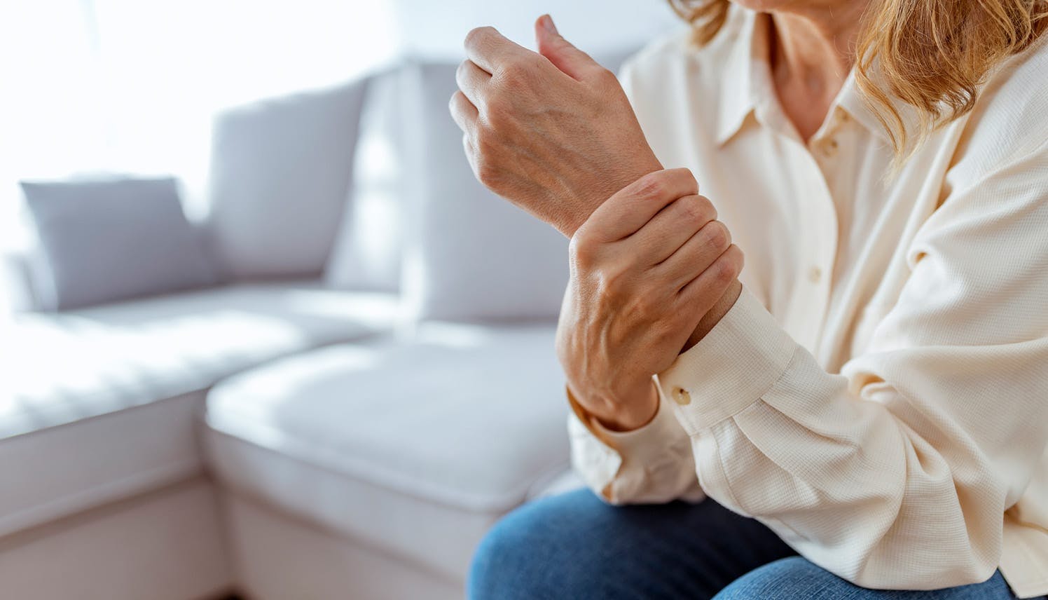 woman holding her wrist