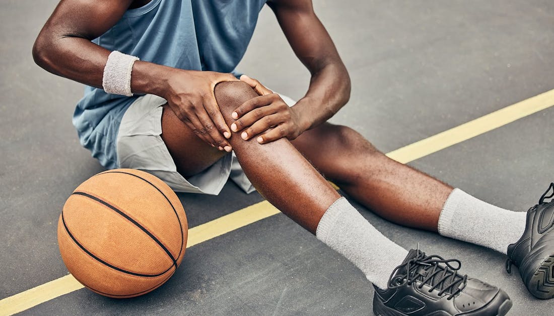 woman holding a volley ball on a court