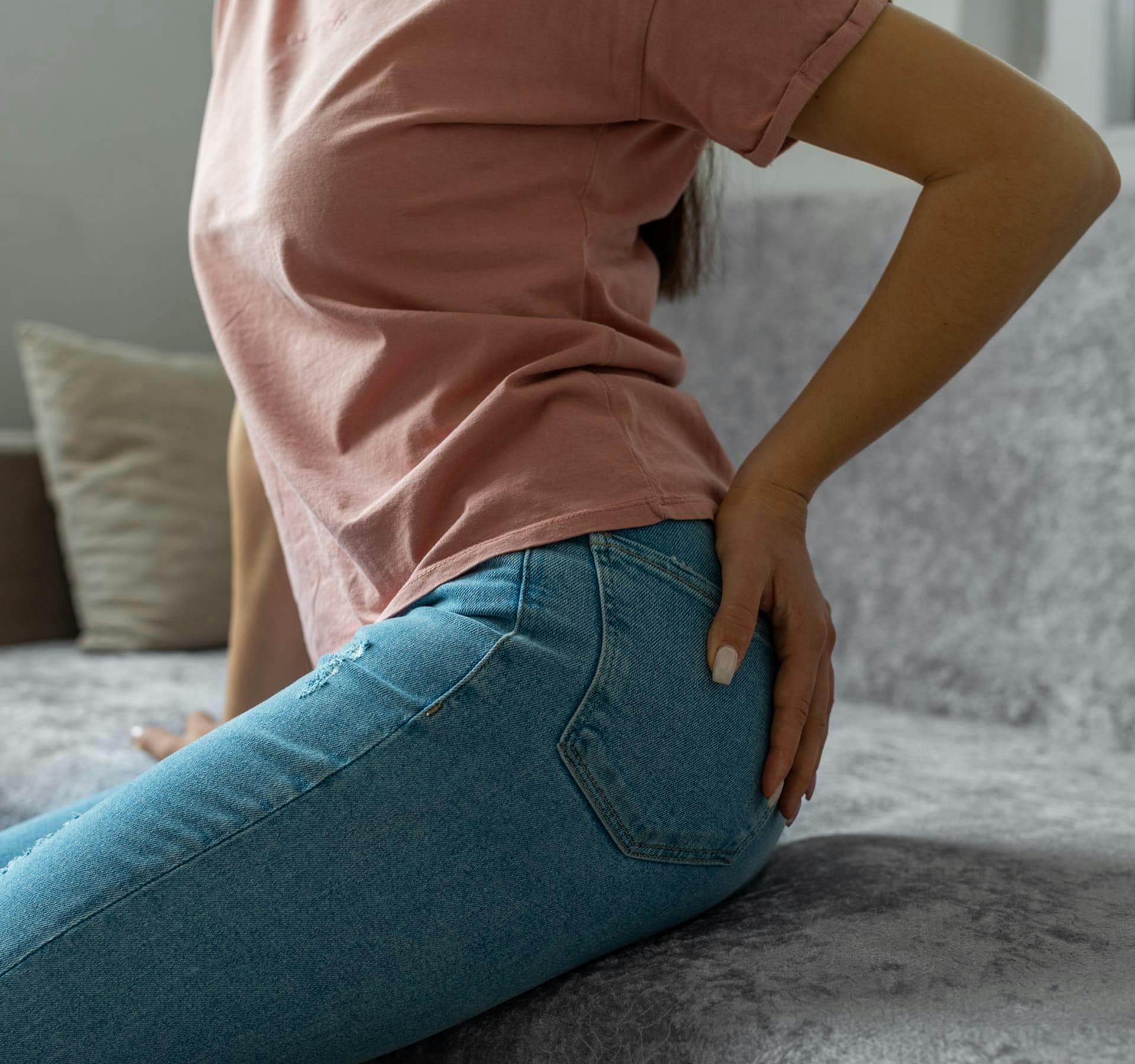 man holding glute area