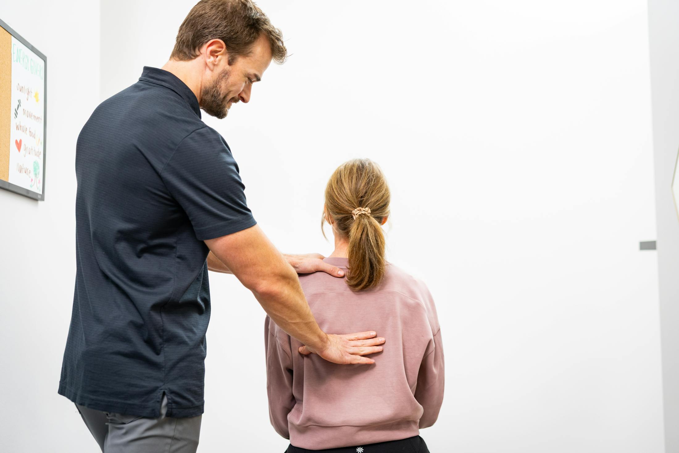 Chiropractor giving adjustment to patient