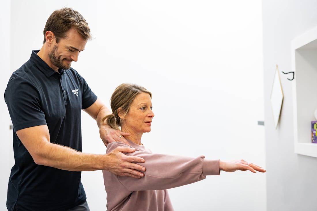 chiropractor adjusting shoulder