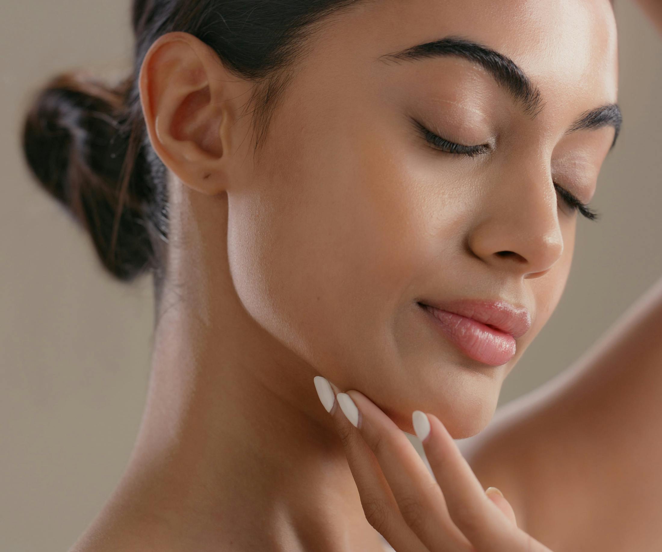 woman touching her chin