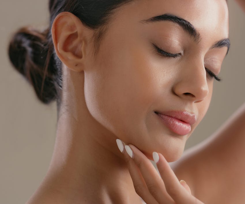 woman touching her chin
