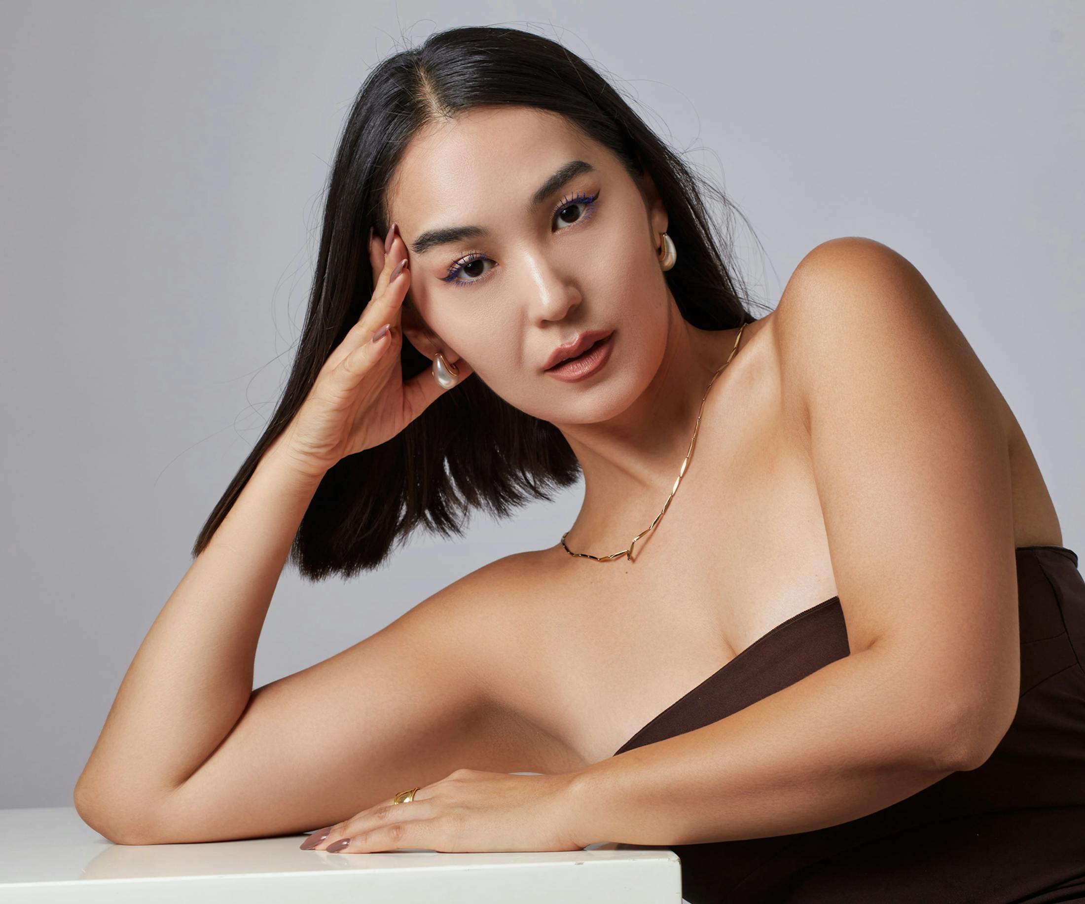 woman leaning on a table