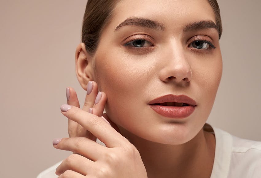 Woman touching her face