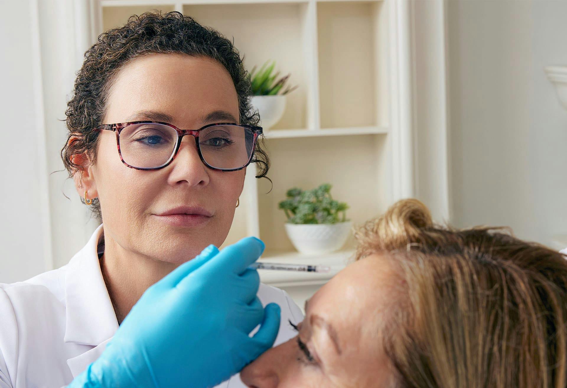 Woman and doctor during treatment