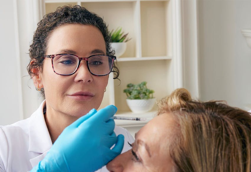 Woman and doctor during treatment