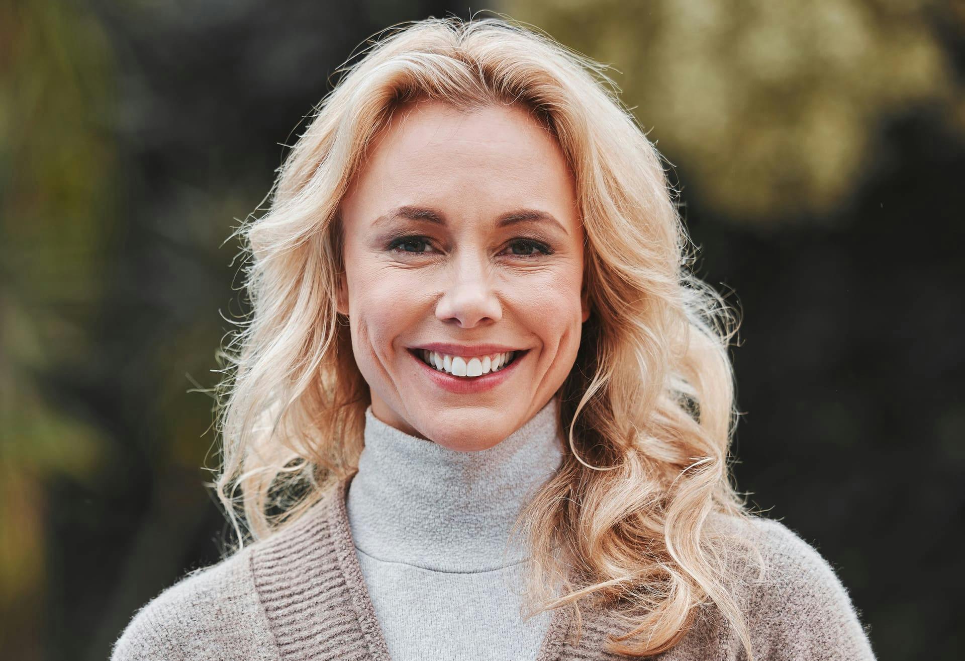 Woman smiling outside
