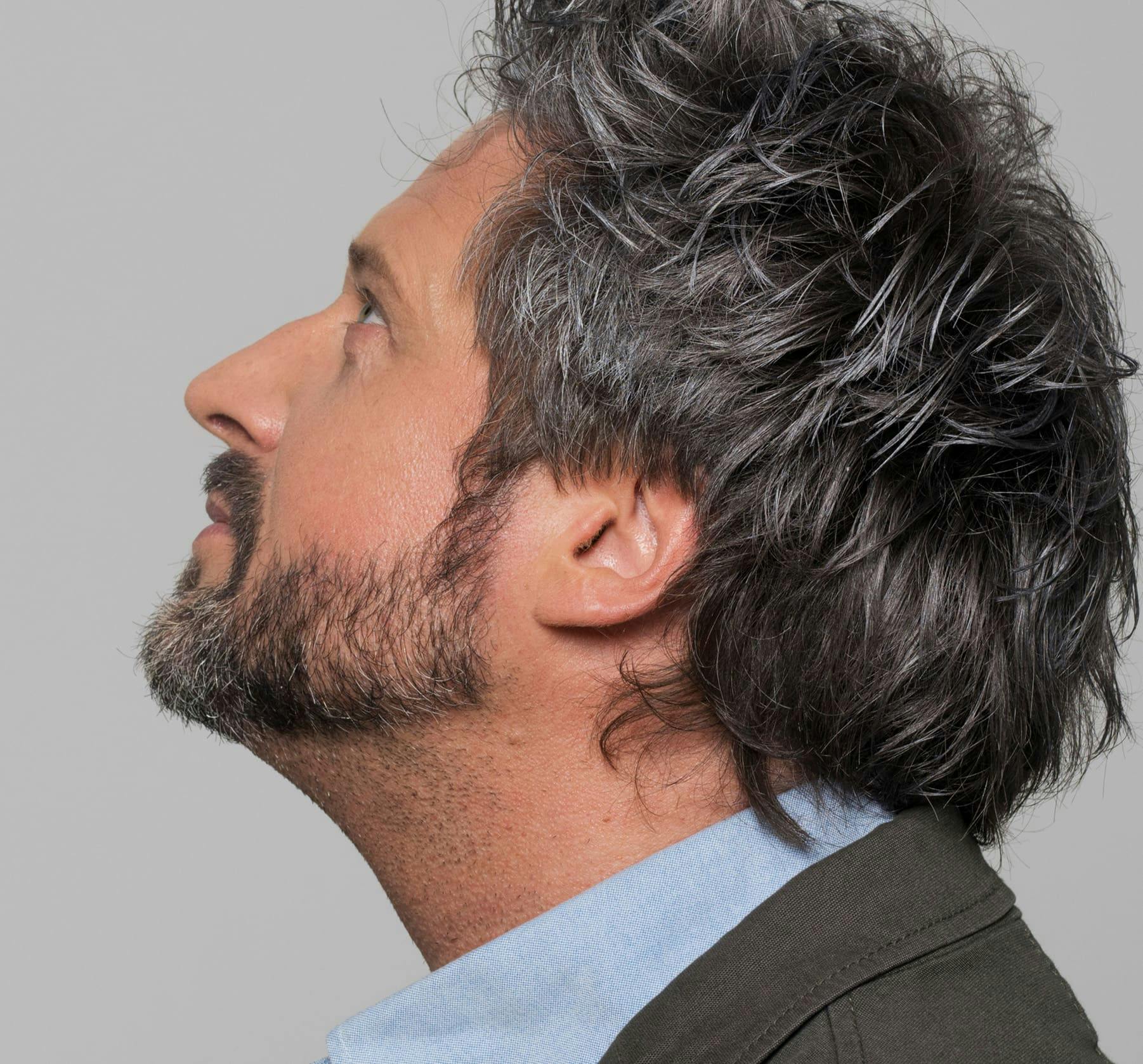 man tilting his head back
