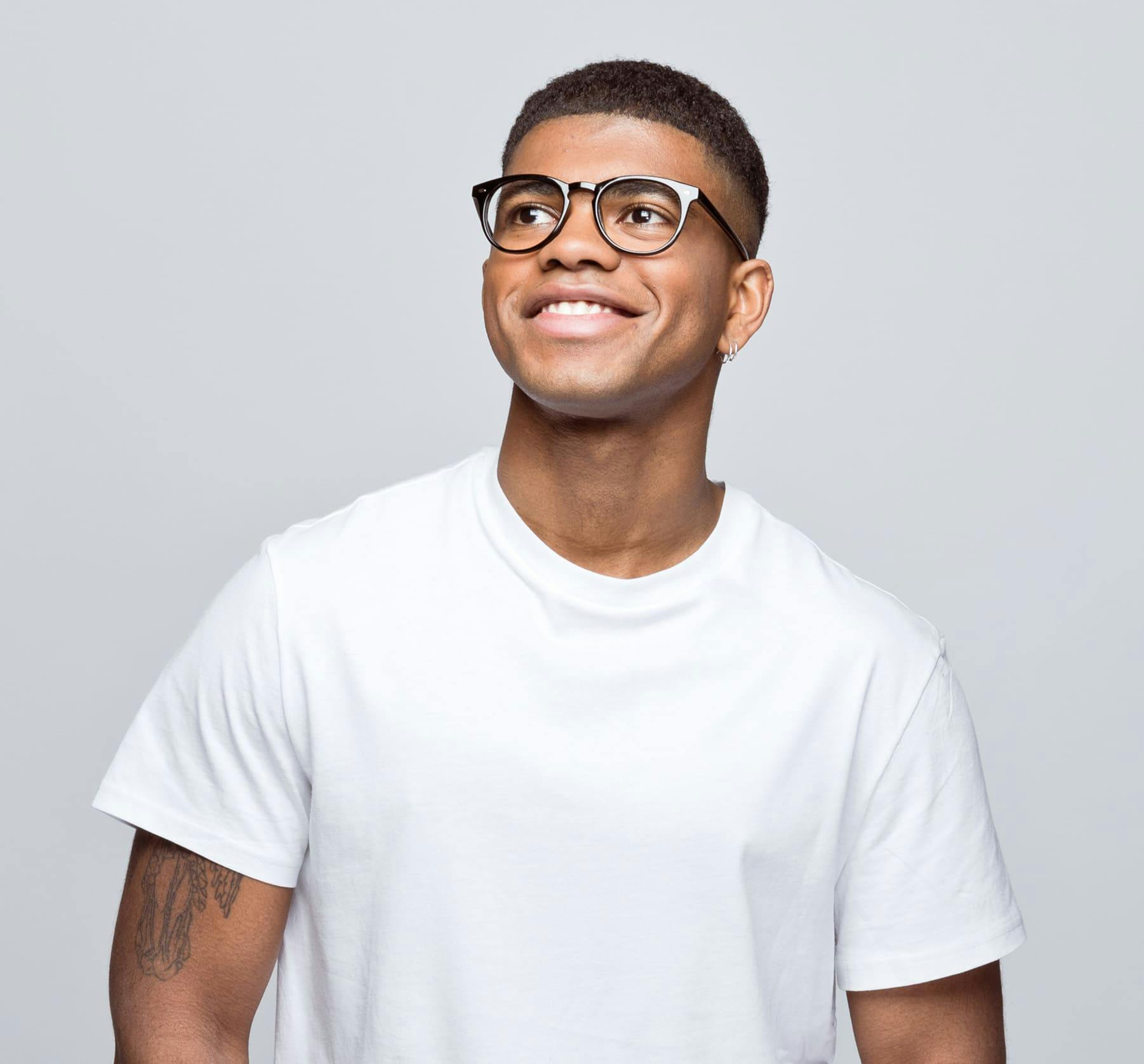 man in white t-shirt with black glasses on