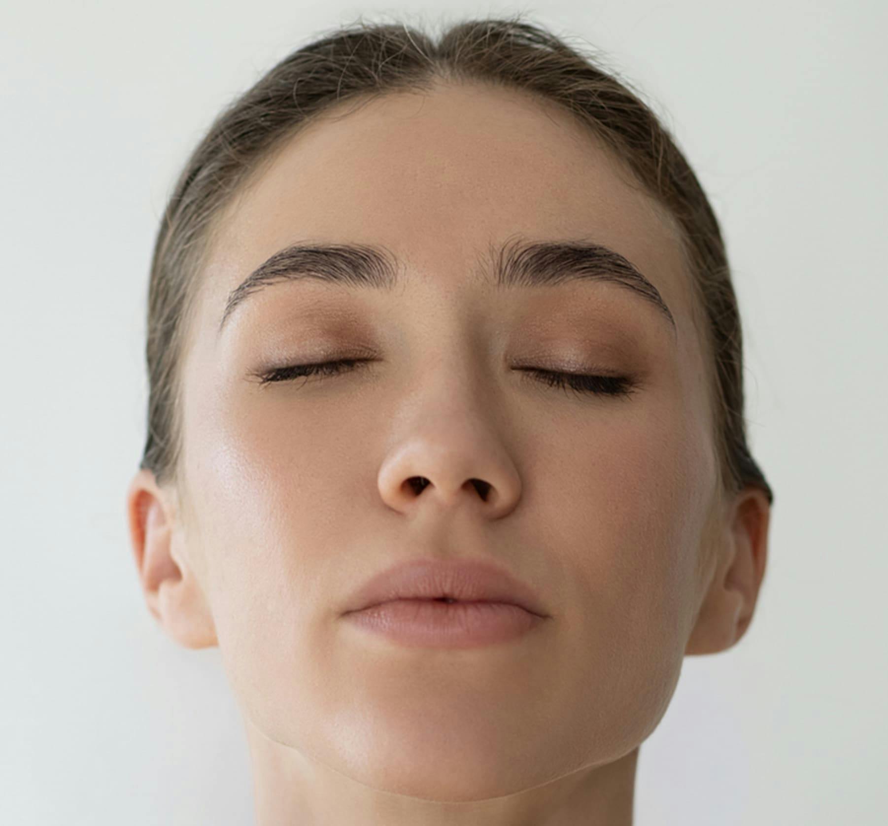 Close up of a woman closing her eyes
