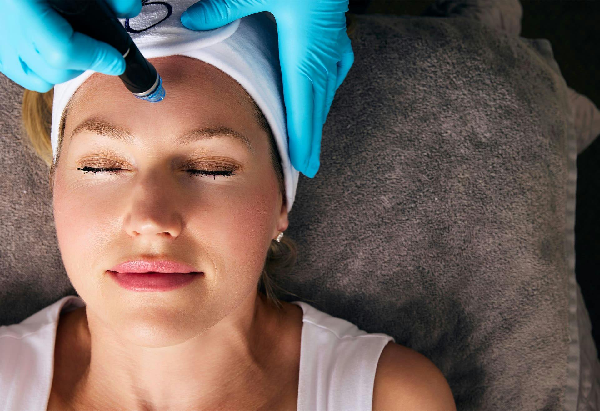 woman getting facial treatment done