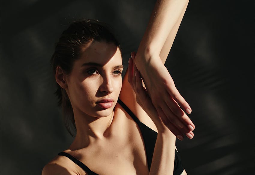 Woman with her hands making shapes