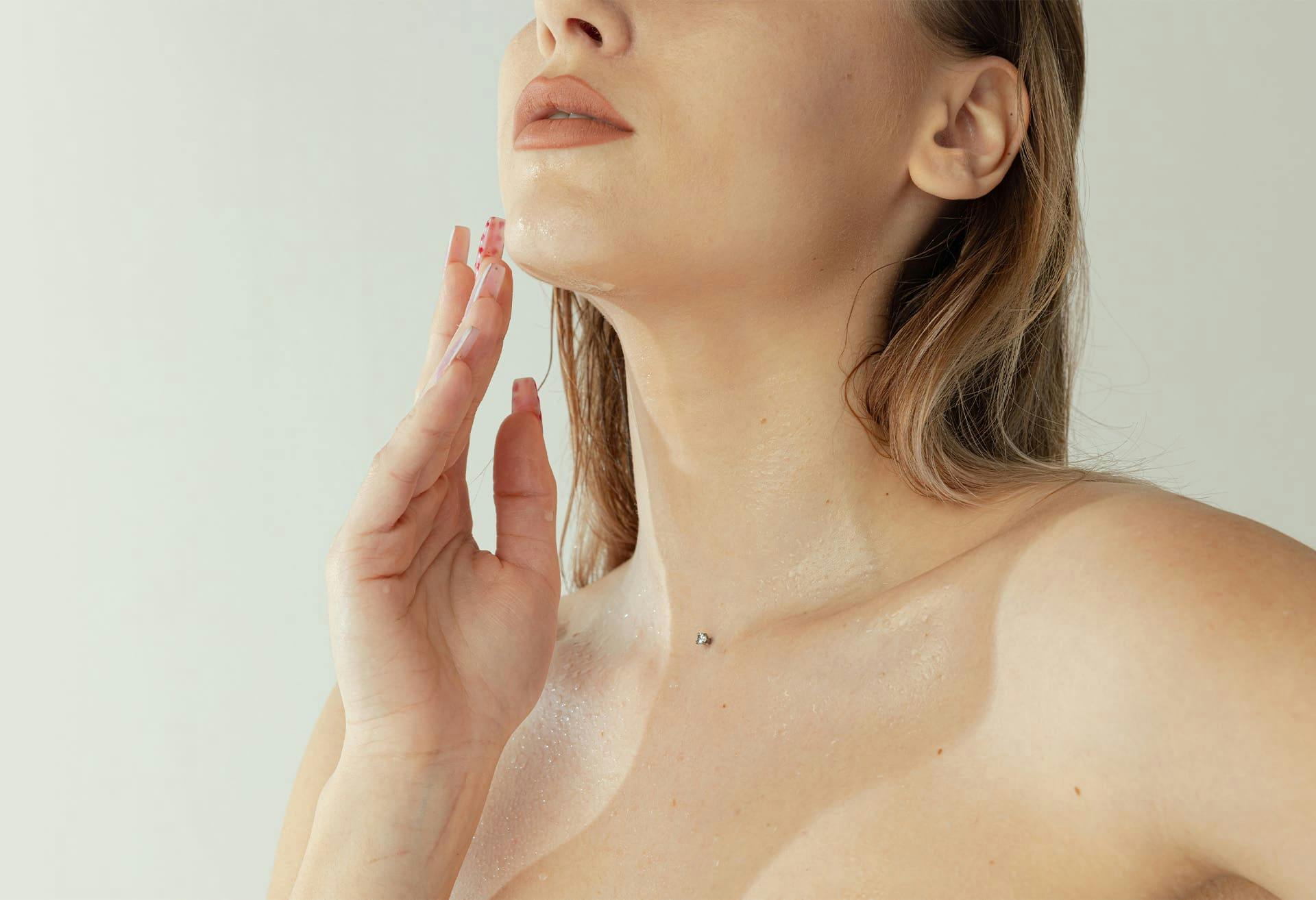 Woman touching chin