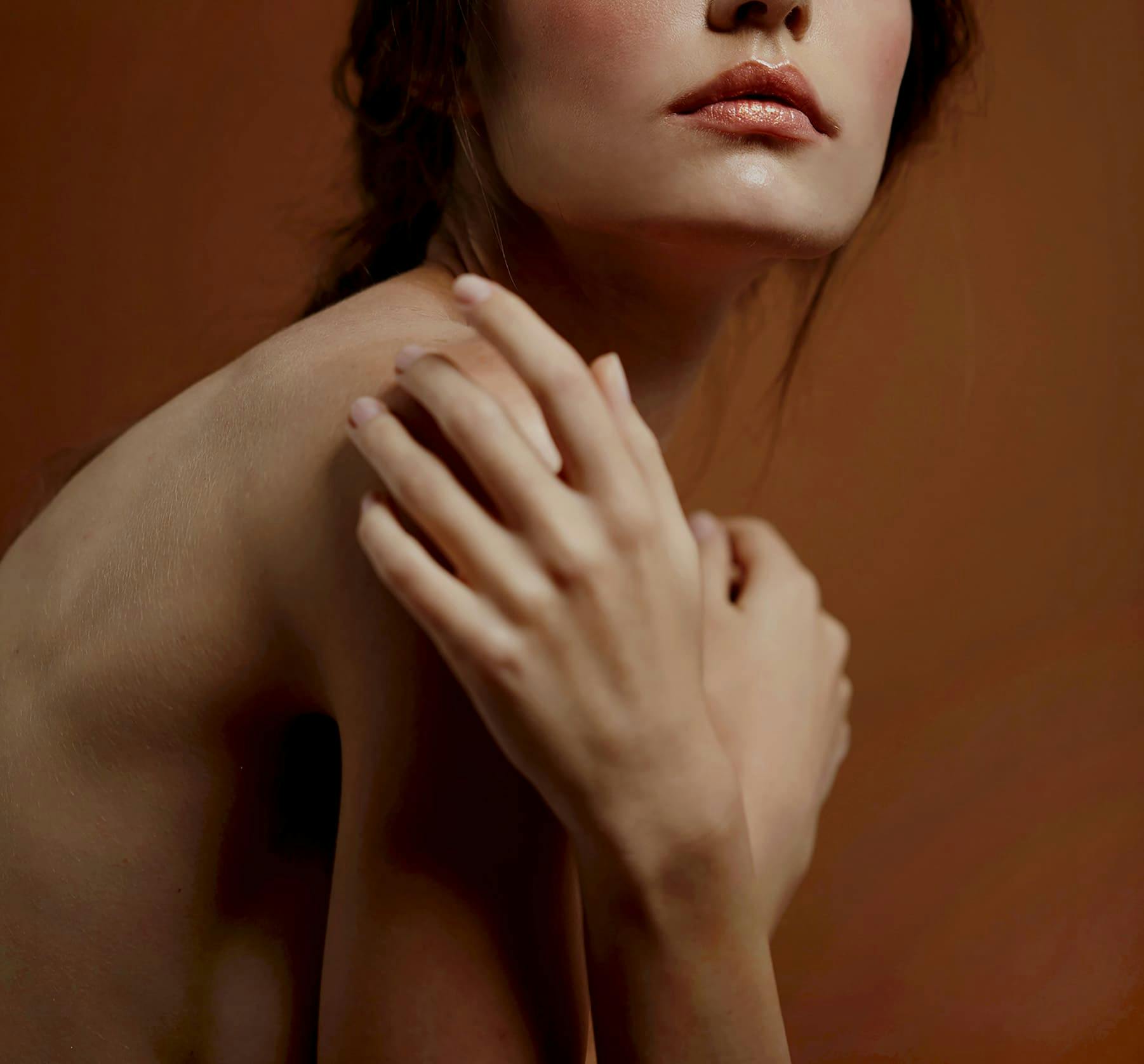 Woman touching her shoulder