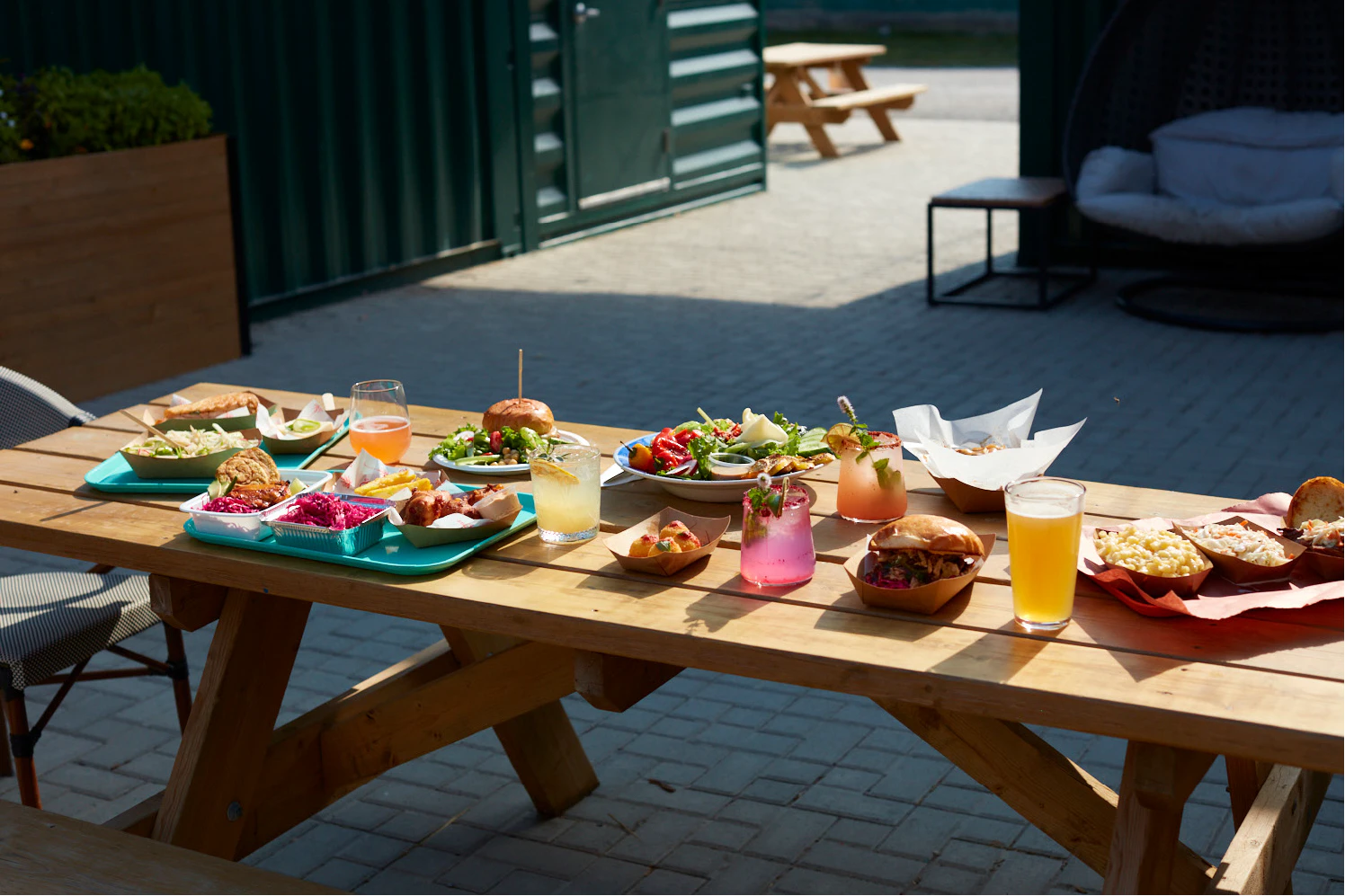 A outdoor picnic table with food in B31 District