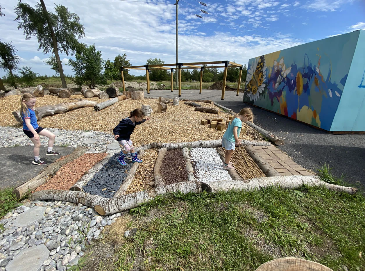 Kids playing in the Sensory Garden at Base31