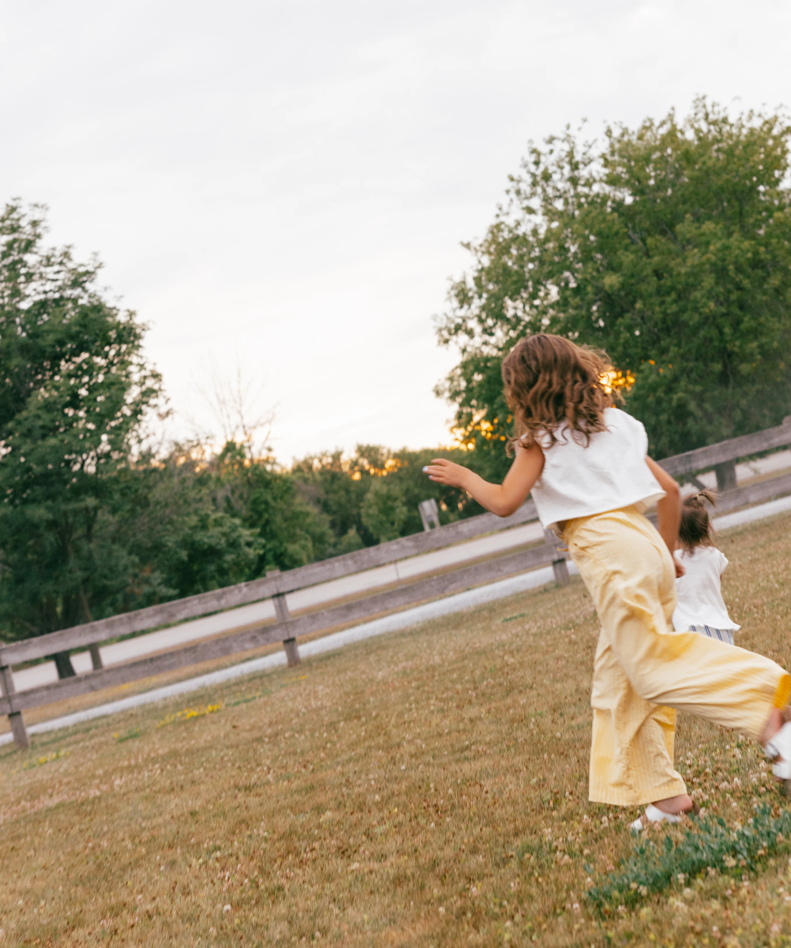 Mother and Daughter running at Base Living