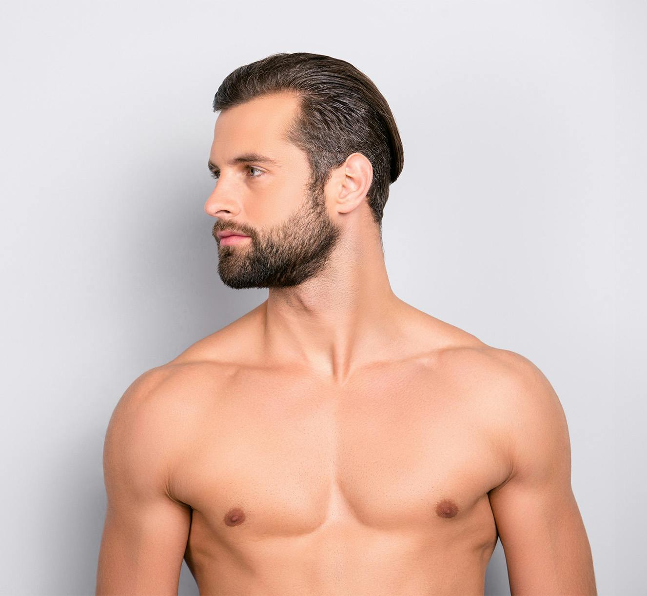 man shirtless looking to the left